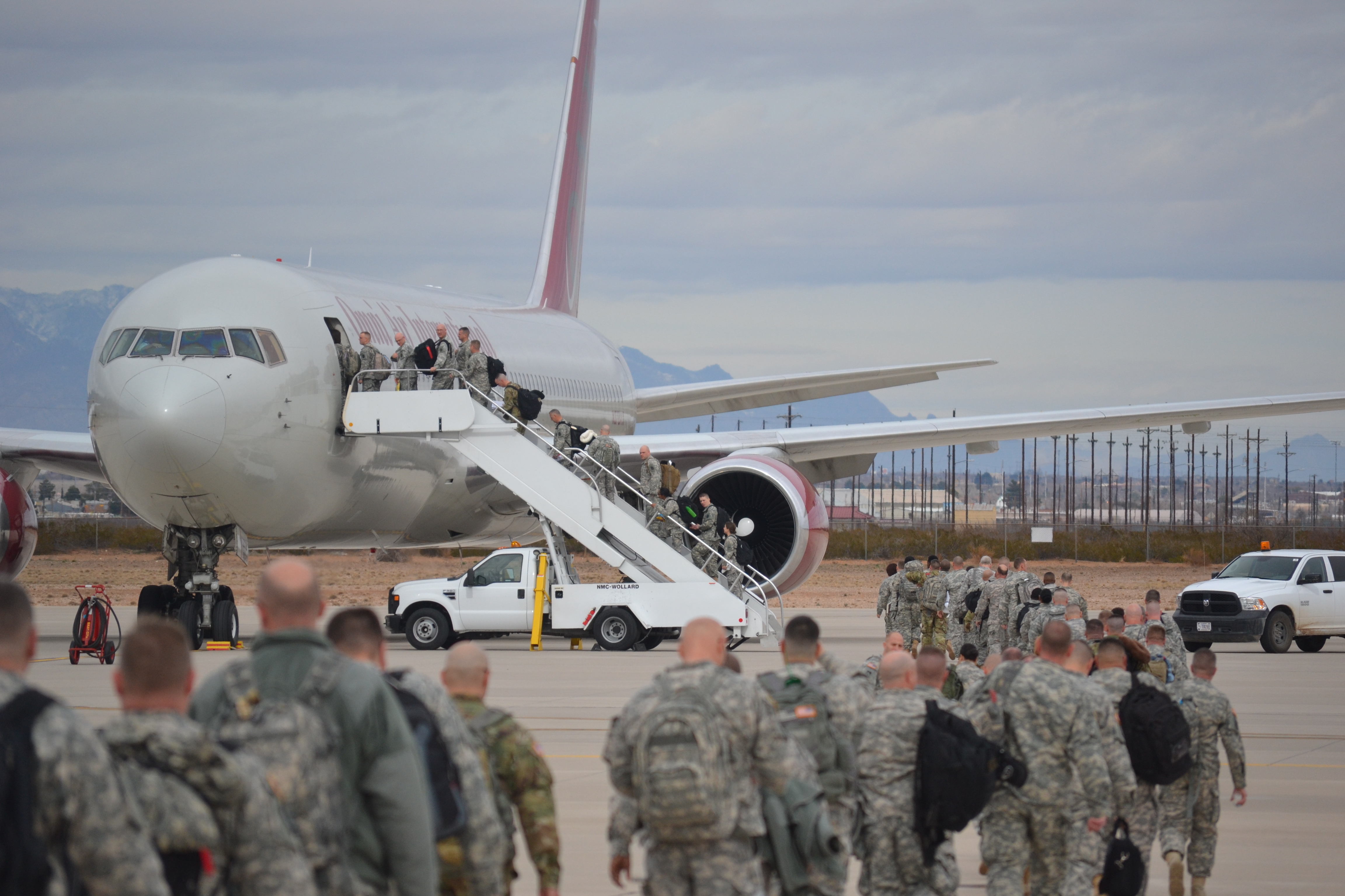 Photo of a C-130 Loading Up with troops and their gear.